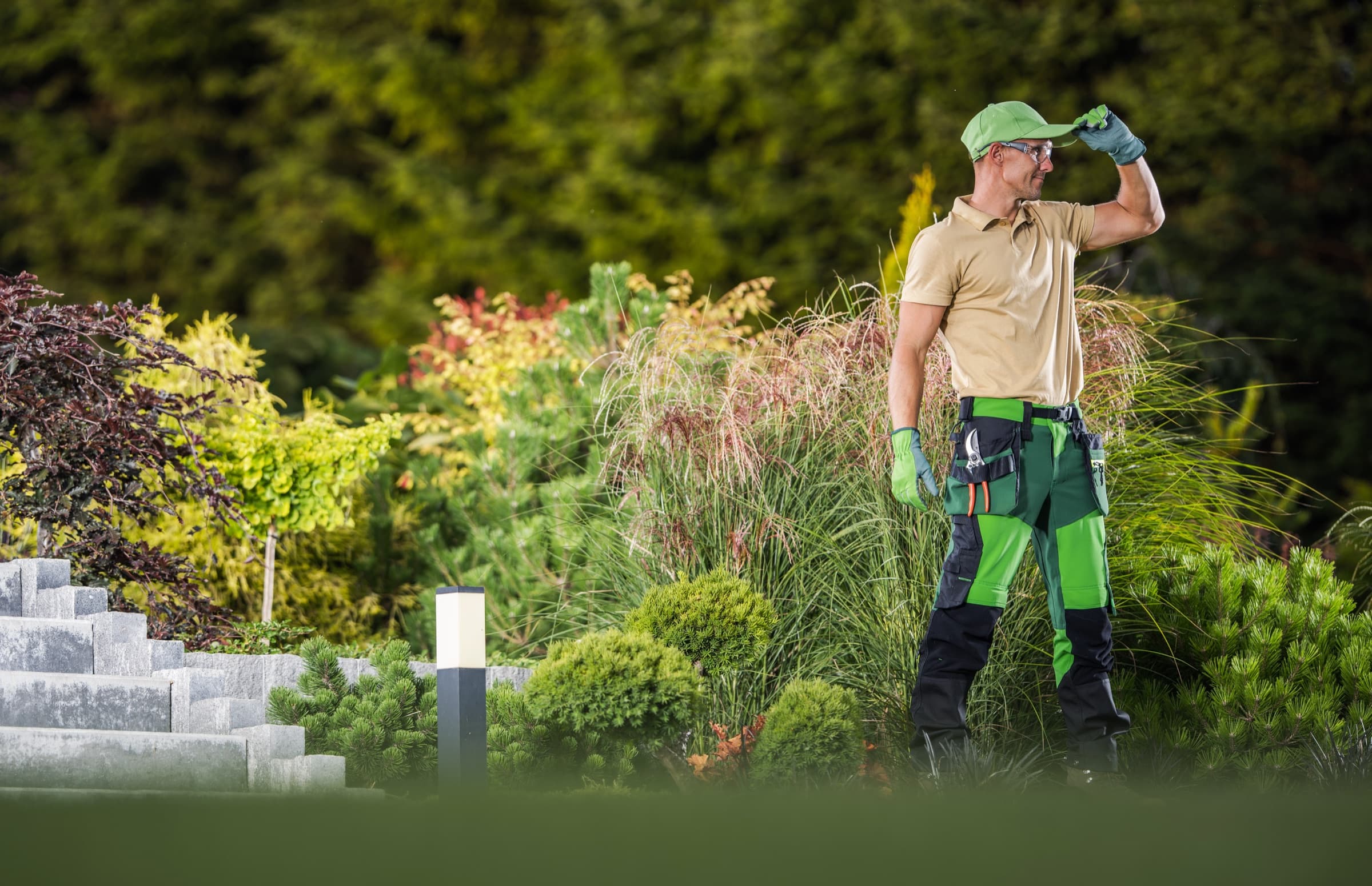 A landscaper working in a garden